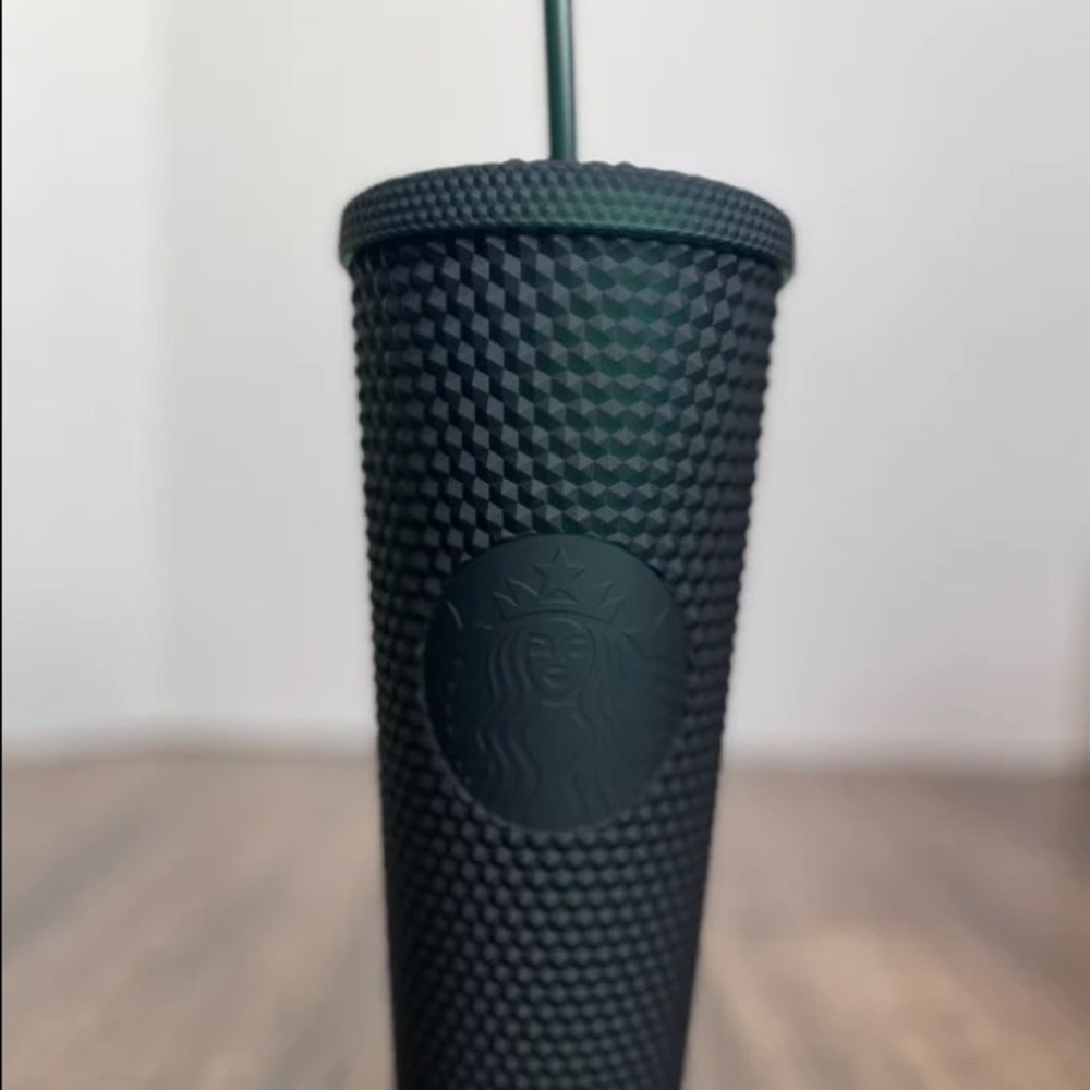 Dark green studded Starbucks cup